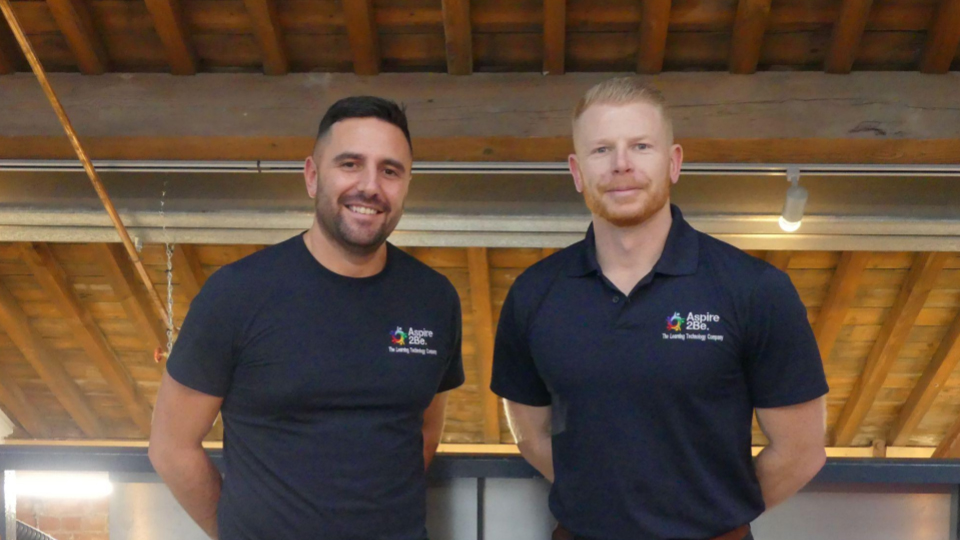 Two members of Aspire 2Be staff
